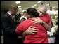 President George W. Bush hugs a woman displaced by Hurricane Katrina during his visit Monday, Sept. 5, 2005 at the Bethany World Prayer Center shelter in Baton Rouge, La. White House photo by Eric Draper