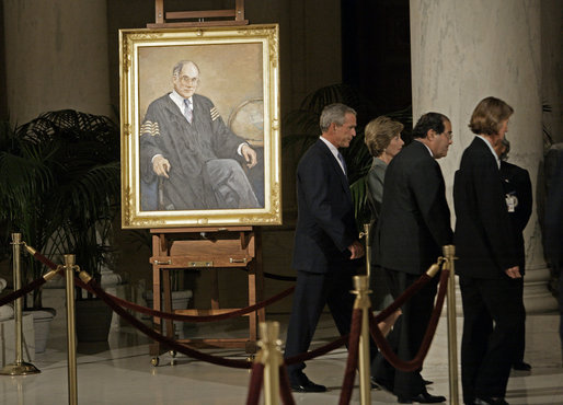 President George W. Bush and Laura Bush walk with Justice Antonin Scalia and Sally Rider, the Chief Justice's assistant, after viewing a portrait of Chief Justice William Rehnquist as his body lies in repose in the Great Hall of the U.S. Supreme Court Tuesday, Sept. 6, 2005. White House photo by Eric Draper