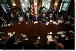 President George W. Bush is joined by members of his cabinet as he speaks with news reporters, Tuesday, Sept. 6, 2005, in the Cabinet Room at the White House.  White House photo by Paul Morse