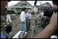 Vice President Dick Cheney walks with Mayor Brent Warr, Thursday, Sept. 8, 2005, through a neighborhood in Gulfport, Miss., devastated by Hurricane Katrina, as they talk with surviving residents. White House photo by David Bohrer