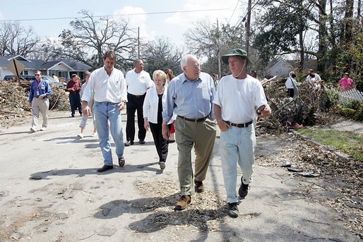 Vice President Dick Cheney walks with a resident of a Gulfport, Mississippi neighborhood Thursday, September 8, 2005. The area was damaged by Hurricane Katrina, which hit both Louisiana and Mississippi on August 29th. Mrs. Cheney and Mayor Brent Warr are also shown walking. White House photo by David Bohrer