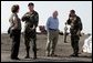 Vice President Dick Cheney and Governor Kathleen Blanco talk with members of the US Army Corp of Engineers during a tour of the 17th street levee repair operations in New Orleans, Louisiana Thursday, September 8, 2005. The Vice President's tour of the city includes visits with police and EMS personnel working in the area. White House photo by David Bohrer