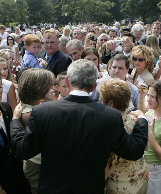 President George W. Bush meets some of the hundreds of family and friends who gathered on the South Lawn of the White House, Friday, Sept. 9, 2005, during the 9/11 Heroes Medal of Valor Award ceremony, in honor of the courage and commitment of emergency services personnel who died on Sept. 11, 2001. White House photo by Eric Draper