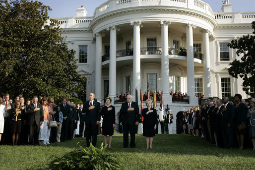 President Bush stands with Laura Bush, Vice President Dick Cheney and Mrs. Cheney as they observe a moment of silence, on the South Lawn, in honor of 9/11 victims September 11, 2005. This marks the fourth anniversary of terrorist attacks on both the World Trade Center and The Pentagon. White House photo by Krisanne Johnson