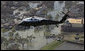 President George W. Bush flies over the hurricane ravaged neighborhoods of New Orleans, La., in Marine One, Monday, Sept. 12, 2005. White House photo by Paul Morse