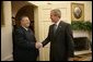 President George W. Bush welcomes President Jalal Talabani of Iraq into the Oval Office, Tuesday, Sept. 13. 2005 at the White House in Washington. White House photo by Eric Draper