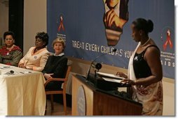 Laura Bush listens to Jeannette Kagame, the First Lady of Rwanda and President of the Organization of African First Ladies Against HIV/AIDS, addresses the group in New York Thursday, Sept. 15, 2005.  White House photo by Krisanne Johnson