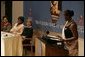 Laura Bush listens to Jeannette Kagame, the First Lady of Rwanda and President of the Organization of African First Ladies Against HIV/AIDS, addresses the group in New York Thursday, Sept. 15, 2005. White House photo by Krisanne Johnson