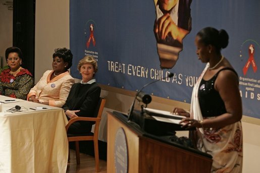 Laura Bush listens to Jeannette Kagame, the First Lady of Rwanda and President of the Organization of African First Ladies Against HIV/AIDS, addresses the group in New York Thursday, Sept. 15, 2005. White House photo by Krisanne Johnson