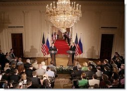 President George W. Bush and Russian President Vladimir Putin appear together at a joint news conference in the East Room of the White House, Friday, Sept. 16, 2005 in Washington.  White House photo by Eric Draper