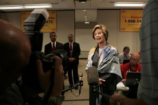 Laura Bush talks with the press during her visit to the National Center for Missing & Exploited Children in Alexandria, Va., Friday, Sept. 16, 2005. White House photo by Krisanne Johnson