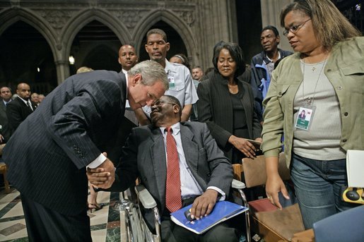 President George W. Bush greets one of the Hurricane Katrina evacuees attending the National Day of Prayer and Remembrance Service at the Washington National Cathedral in Washington, D.C., Friday, Sept. 16, 2005. White House photo by Eric Draper