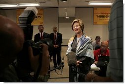 Laura Bush talks with the press during her visit to the National Center for Missing & Exploited Children in Alexandria, Va., Friday, Sept. 16, 2005.  White House photo by Krisanne Johnson