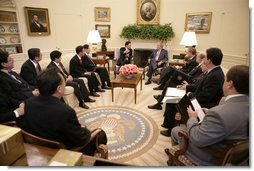 President George W. Bush meets with Thailand's Prime Minister Thaksin Shinawatra, during a visit to the Oval Office at the White House, Monday, Sept. 19, 2005 in Washington.  White House photo by Eric Draper