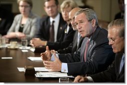 Flanked by Secretary of Defense Donald Rumsfeld and Secretary of Homeland Security Michael Chertoff, President George W. Bush speaks to members of the Homeland Security Council during a meeting Monday, Sept. 19, 2005, in the Cabinet Room of the White House.  White House photo by Eric Draper