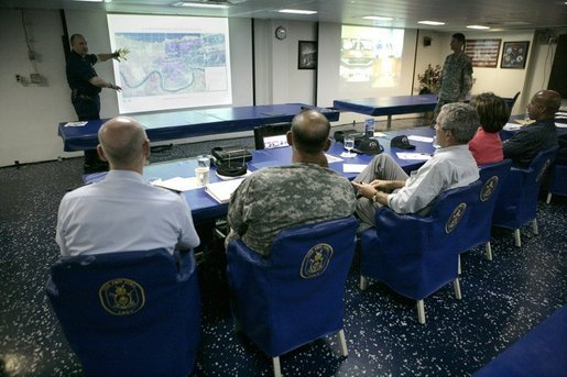 President George W. Bush listens to U.S. Coast Guard Vice Admiral Thad Allen, seen at screen, during a briefing on the present conditions in New Orleans and on Hurricane Rita, Tuesday, Sept. 20, 2005, aboard the USS Iwo Jima in New Orleans, La., with Rear Admiral Larry Hereth, left, U.S. Army Lt. General Russel Honore, Louisiana Governor Kathleen Blanco and New Orleans Mayor Ray Nagin. White House photo by Eric Draper