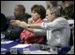 President George W. Bush gestures as he participates in a briefing on Hurricane Rita, Tuesday, Sept. 20, 2005, aboard the USS Iwo Jima in New Orleans, La., with Louisiana Governor Kathleen Blanco and New Orleans Mayor Ray Nagin. White House photo by Eric Draper