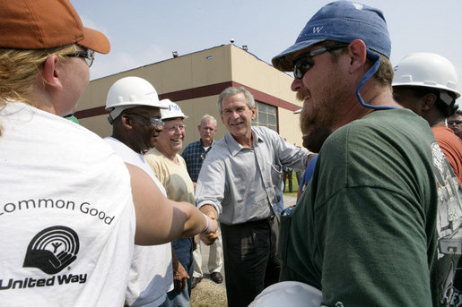 President George W. Bush greets construction workers outside the Folgers Coffee plant in New Orleans, LA, Tuesday, Sept. 20, 2005. White House photo by Eric Draper