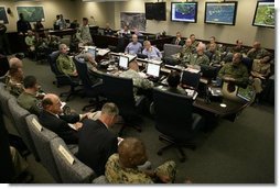 President George W. Bush receives a briefing with personnel from all branches of the military on Hurricanes Katrina and Rita inside NORAD's United States Northern Command in Colorado Springs, Colorado, Saturday, Sept. 24, 2005. White House photo by Eric Draper