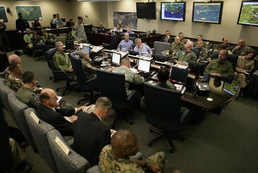 President George W. Bush receives a briefing with personnel from all branches of the military on Hurricanes Katrina and Rita inside NORAD's United States Northern Command in Colorado Springs, Colorado, Saturday, Sept. 24, 2005. White House photo by Eric Draper