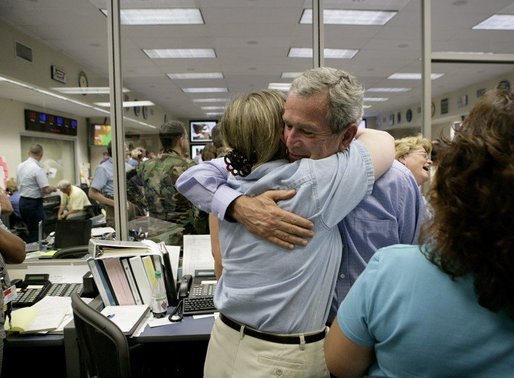 President George W. Bush hugs a worker while visiting with emergency personnel inside the Texas Emergency Operations Center in Austin, Texas, Saturday, Sept. 24, 2005. White House photo by Eric Draper