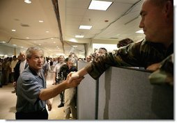 President George W. Bush thanks emergency personnel inside the FEMA Joint Field Office in Baton Rouge, Louisiana, Sunday, Sept. 25, 2005.  White House photo by Eric Draper