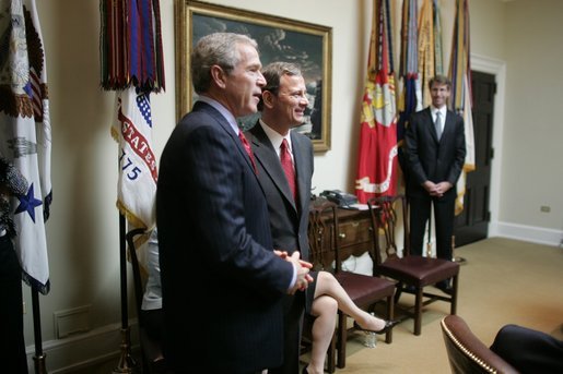 President George W. Bush stands in the Roosevelt Room of the White House with Judge John Roberts Thursday, Sept. 29, 2005, after the Senate vote confirming Judge Roberts as the 17th Chief Justice of the United States was announced on television. White House photo by Paul Morse