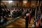 Chief Justice John G. Roberts receives a standing-ovation after he is sworn-in as the 17th Chief Justice of the United States, Thursday, Sept. 29, 2005 in the East Room of the White House in Washington. Chief Justice Roberts is applauded by President George W. Bush and fellow judges of the U.S. Supreme Court. White House photo by Paul Morse