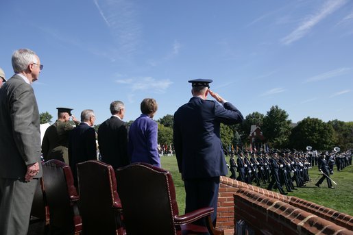 President George W. Bush stands with Defense Secretary Donald Rumsfeld, General Richard B Myers, his wife, Mary Jo Myers and General Peter Pace during review of the troops, Friday, Sept. 30, 2005, at The Armed Forces Farewell Tribute in Honor of General Richard B. Myers and the Armed Forces Hail in Honor of General Peter Pace at Fort Myer's Summerall Field in Ft. Myer, Va. White House photo by Paul Morse