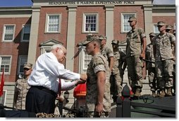 Vice President Dick Cheney pins the Purple Heart Medal onto U.S. Marine CPL Daniel Foot during a rally at Camp Lejeune in Jacksonville, NC, Monday, October 3, 2005. The Vice President presented five Marines with medal at that time. White House photo by David Bohrer