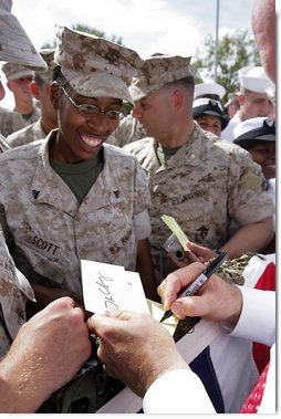 Vice President Dick Cheney shakes hands and signs autographs with U.S. Marine Personnel during a rally at Camp Lejeune in Jacksonville, NC, Monday, October 3, 2005. White House photo by David Bohrer