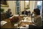 President George W. Bush is joined for lunch Wednesday, Oct. 5, 2005, by Secretary of State Dr. Condoleezza Rice and Karen Hughes, newly appointed Under Secretary of State for Public Diplomacy and Public Affairs. White House photo by Eric Draper