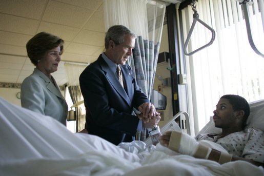 President George W. Bush and Mrs. Laura Bush talk with Sgt. Patrick Hagood of Anderson, S.C., Wednesday, Oct. 5, 2005, during their visit to Walter Reed Army Medical Center in Washington D.C. White House photo by Paul Morse