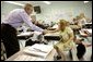 President George W. Bush introduces himself to a student Tuesday, Oct. 11, 2005 at Delisle Elementary School in Pass Christian, Miss., the school reopened Tuesday for the first time since Hurricane Katrina devastated the Gulf Coast region. White House photo by Eric Draper