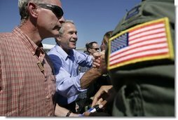 President George W. Bush greets staff personnel at the U.S. Naval Air Station, Joint Reserve Base, Tuesday, Oct. 11, 2005 in New Orleans.  White House photo by Eric Draper