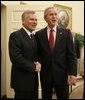 President George W. Bush welcomes Poland's President Aleksander Kwasniewski to the Oval Office at the White House, Wednesday, Oct. 12, 2005 in Washington. White House photo by Eric Draper