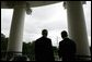 President George W. Bush and Poland's President Aleksander Kwasniewski look toward the Washington Monument, as they stand together on the Truman Balcony at the White House, Wednesday, Oct. 12, 2005 in Washington. White House photo by Eric Draper