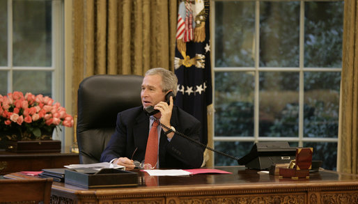 President George W. Bush smiles as he speaks with former British Prime Minister Margaret Thatcher on the occasion of her 80th birthday Thursday, Oct. 13, 2005, in the Oval Office of the White House. White House photo by Eric Draper