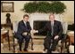 President George W. Bush shakes hands with Bulgarian President Georgi Purvanov prior to taking questions from reporters, Monday, Oct. 17, 2005, in the Oval Office at the White House in Washington. White House photo by Eric Draper