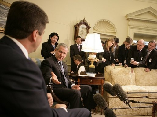 President George W. Bush gestures to Bulgarian President Georgi Purvanov as they take questions from reporters, Monday, Oct. 17, 2005, in the Oval Office at the White House in Washington. White House photo by Eric Draper