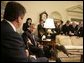 President George W. Bush gestures to Bulgarian President Georgi Purvanov as they take questions from reporters, Monday, Oct. 17, 2005, in the Oval Office at the White House in Washington. White House photo by Eric Draper