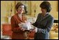 Laura Bush presents Mrs. Zorka Parvanova, First Lady of the Republic of Bulgaria, Monday, October 17, 2005, with signed children's books for the shelves of Sofia City Public Library in Sofia City, Bulgaria. White House photo by Krisanne Johnson