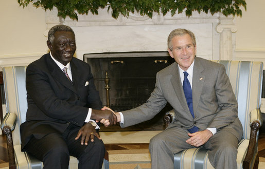 President George W. Bush welcomes Ghana President John A. Kufuor to the Oval Office at the White House, Wednesday, Oct. 26, 2005. President Kufuor arrived in Washington this week to promote trade, investment and tourism in Ghana. White House photo by Eric Draper