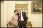 President George W. Bush welcomes activist Charm Tong of Burma to the Oval Office, Monday, Oct. 31, 2005, at the White House in Washington. White House photo by Eric Draper