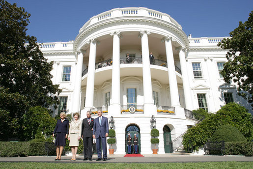 President George W. Bush and Laura Bush welcome the Prince of Wales and Duchess of Cornwall to the White House, Wednesday, Nov. 2, 2005. White House photo by Paul Morse