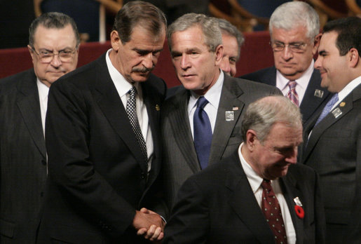 President George W. Bush spends a moment with Mexico's President Vicente Fox following the opening ceremonies Friday, Nov. 4, 2005, of the 2005 Summit of the Americas at the Teatro Auditorium in Mar del Plata, Argentina. White House photo by Eric Draper