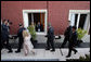 President George W. Bush acknowledges a salute from a well-wisher Friday, Nov. 4, 2005, during the opening ceremonies in Mar del Plata, Argentina, for the 2005 Summit of the Americas. White House photo by Paul Morse