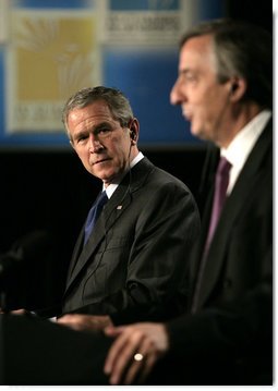 President George W. Bush listens to Argentina's President Nestor Carlos Kirchner as the two hold a joint press availability Friday, Nov. 4, 2005, at the Hermitage Hotel in Mar del Plata, Argentina. White House photo by Eric Draper