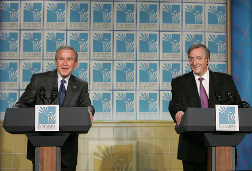 President George W. Bush and Argentina's President Nestor Carlos Kirchner smile as they hold a joint press availability Friday, Nov. 4, 2005, after meeting privately at the Hermitage Hotel in Mar del Plata, Argentina. White House photo by Paul Morse