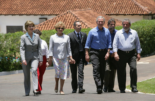 President George W. Bush and Brazil President Luiz Inacio Lula da Silva are joined by their wives, Laura Bush and Marisa Leticia da Silva, as they walk the grounds of President da Silva's Granja do Torto Saturday, Nov. 6, 2005. White House photo by Paul Morse